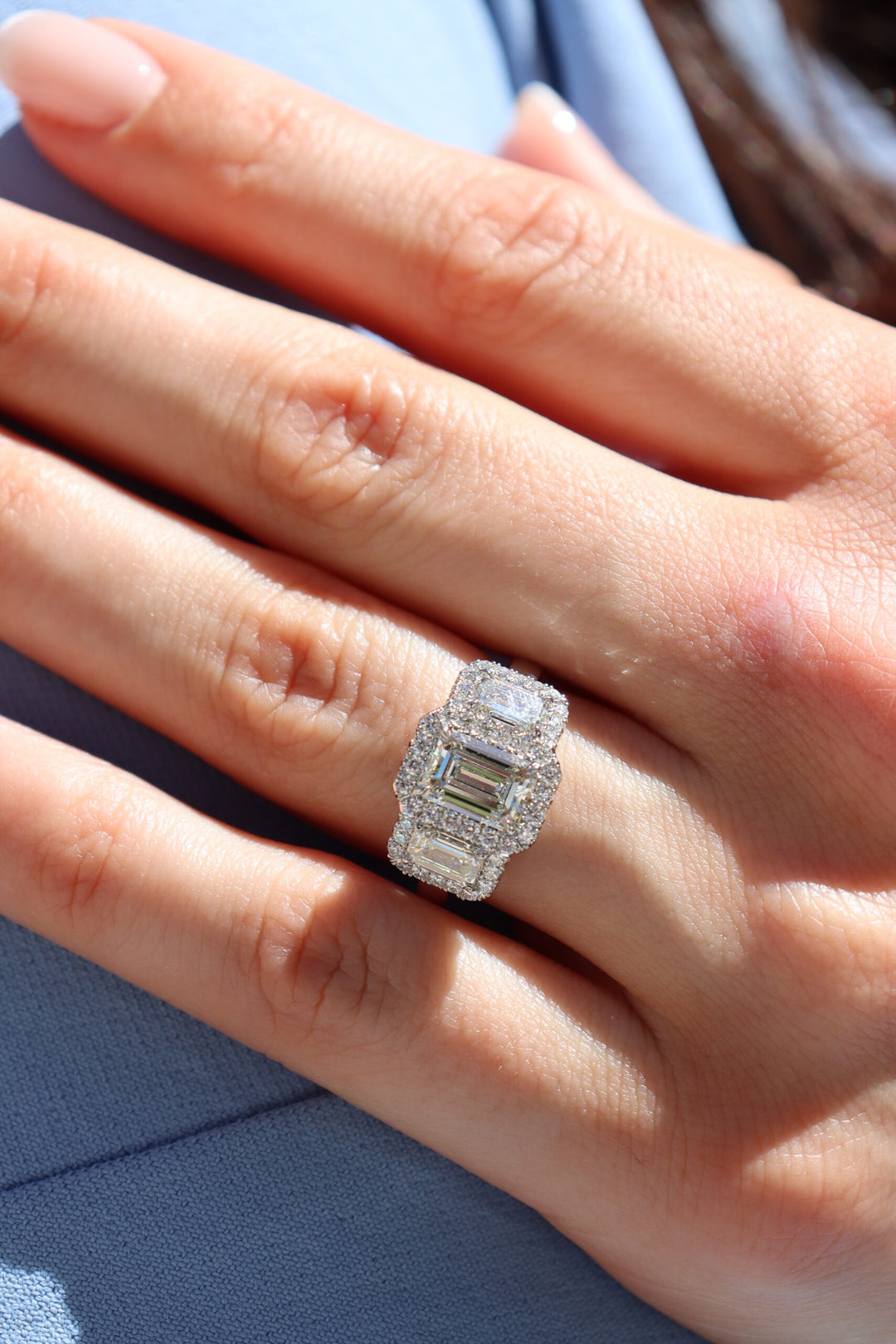 1.51ct Emerald Cut Diamond Signature Three Stone Platinum Ring