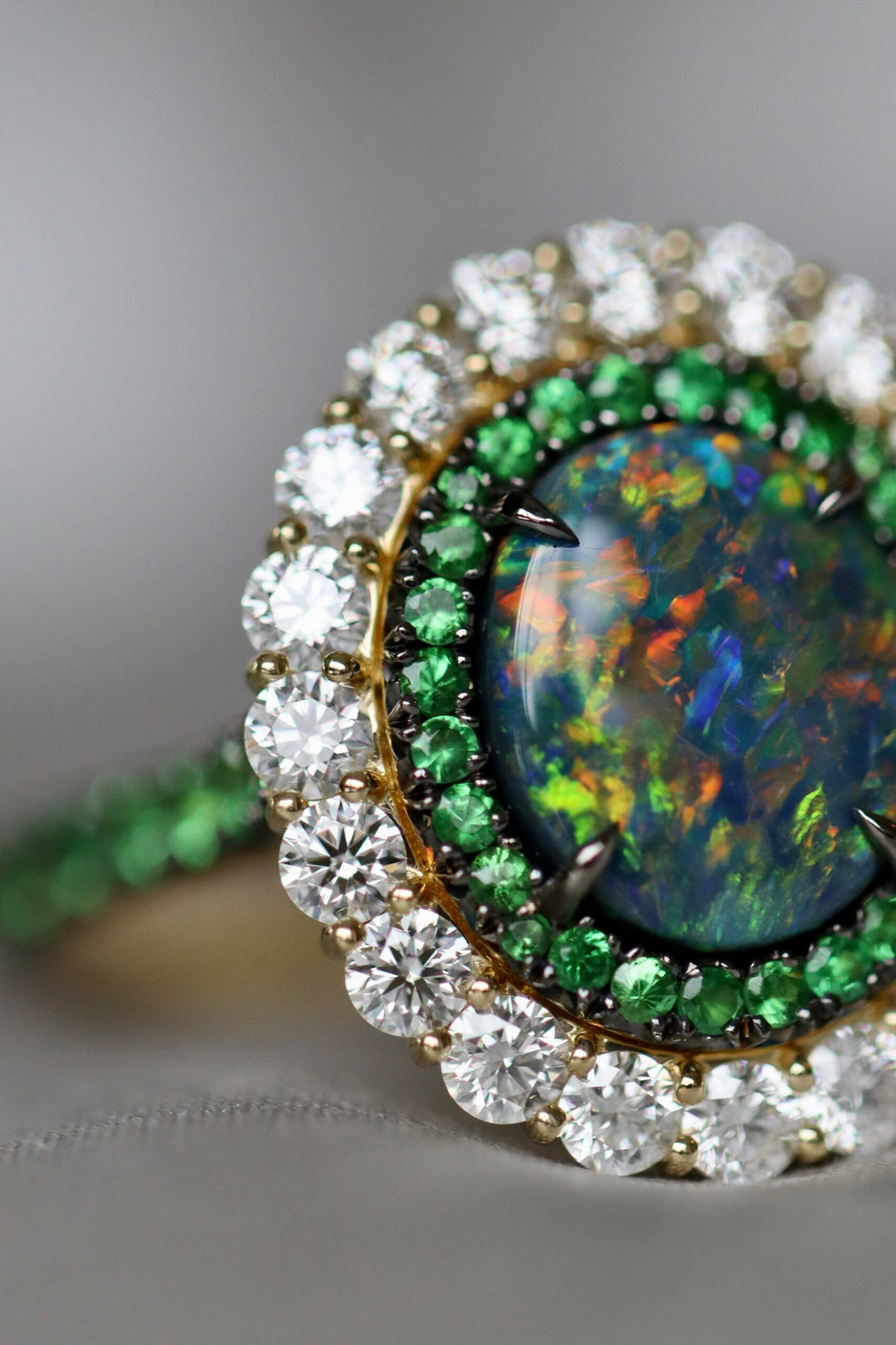 "A Kaleidoscope of Green" 2023 AGTA Award Winning 2.15ct Oval Australian Black Opal, Tsavorite, & Diamond Ring