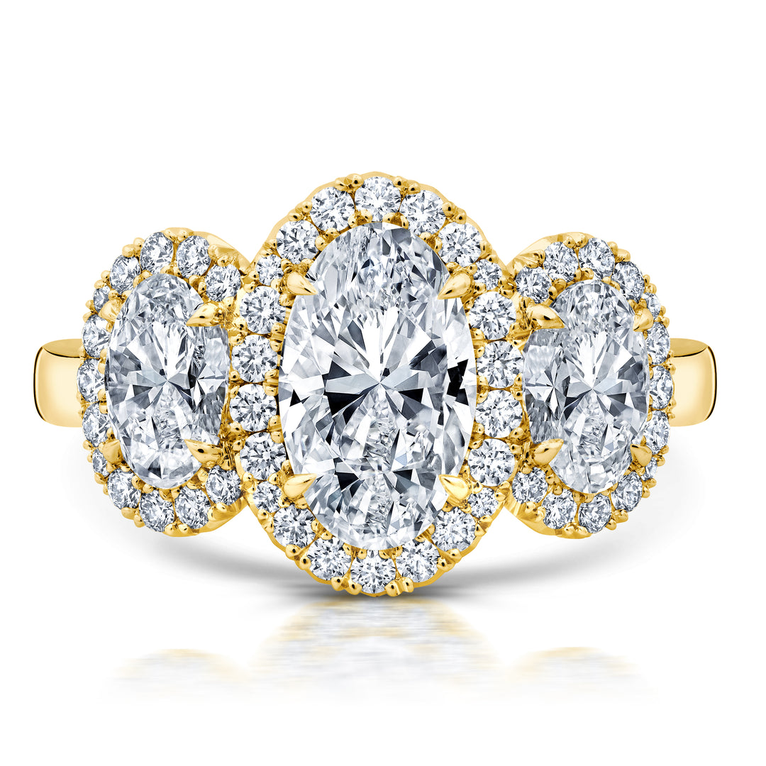 Oval Diamond Halo Three Stone Ring in 18K Yellow Gold